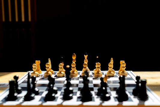 A chessboard featuring black and golden pieces, perfect for mastering control in chess.
