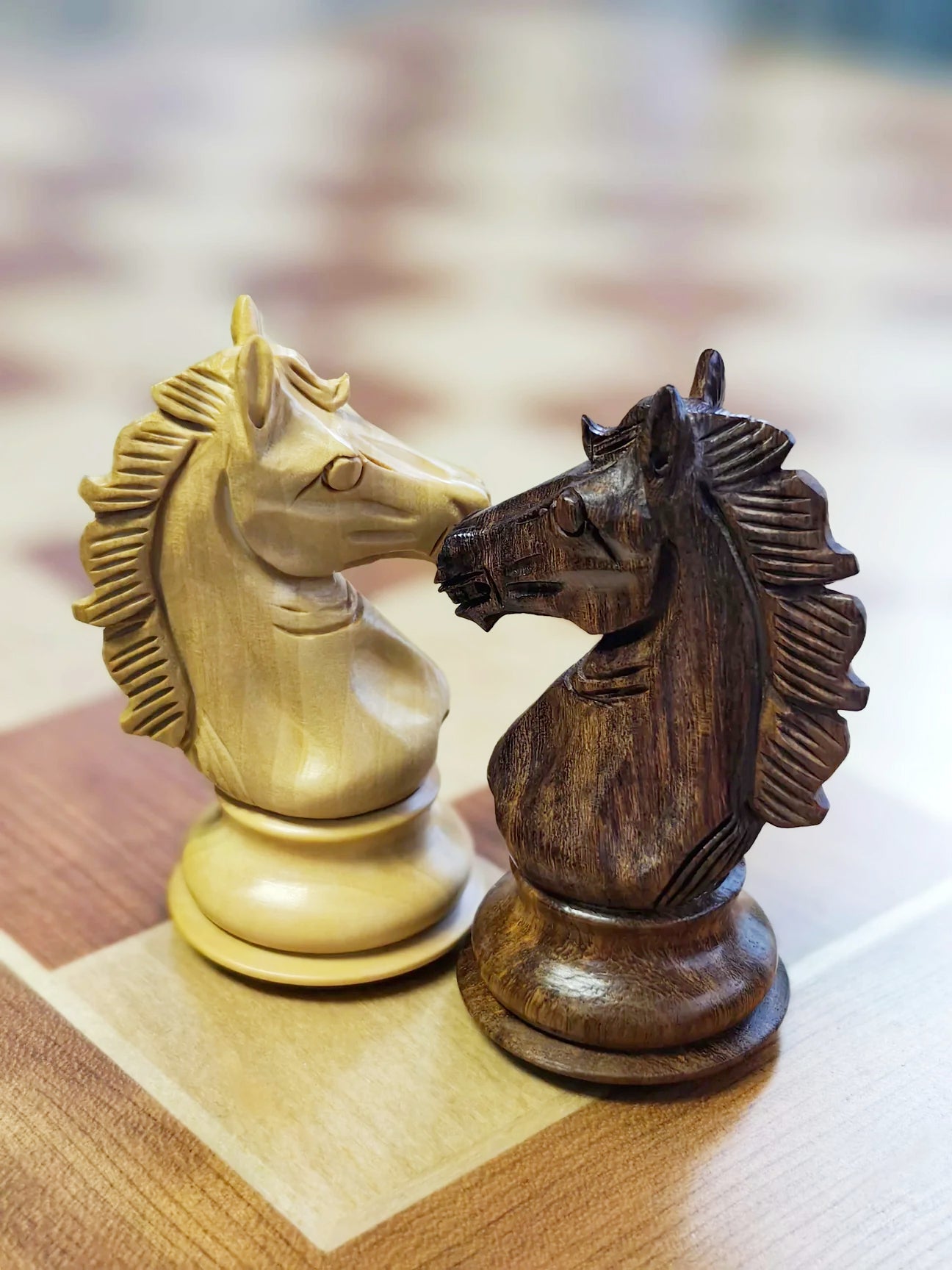 Chessnut Pro premium chess set detail - hand-finished wooden pieces with weighted felt base